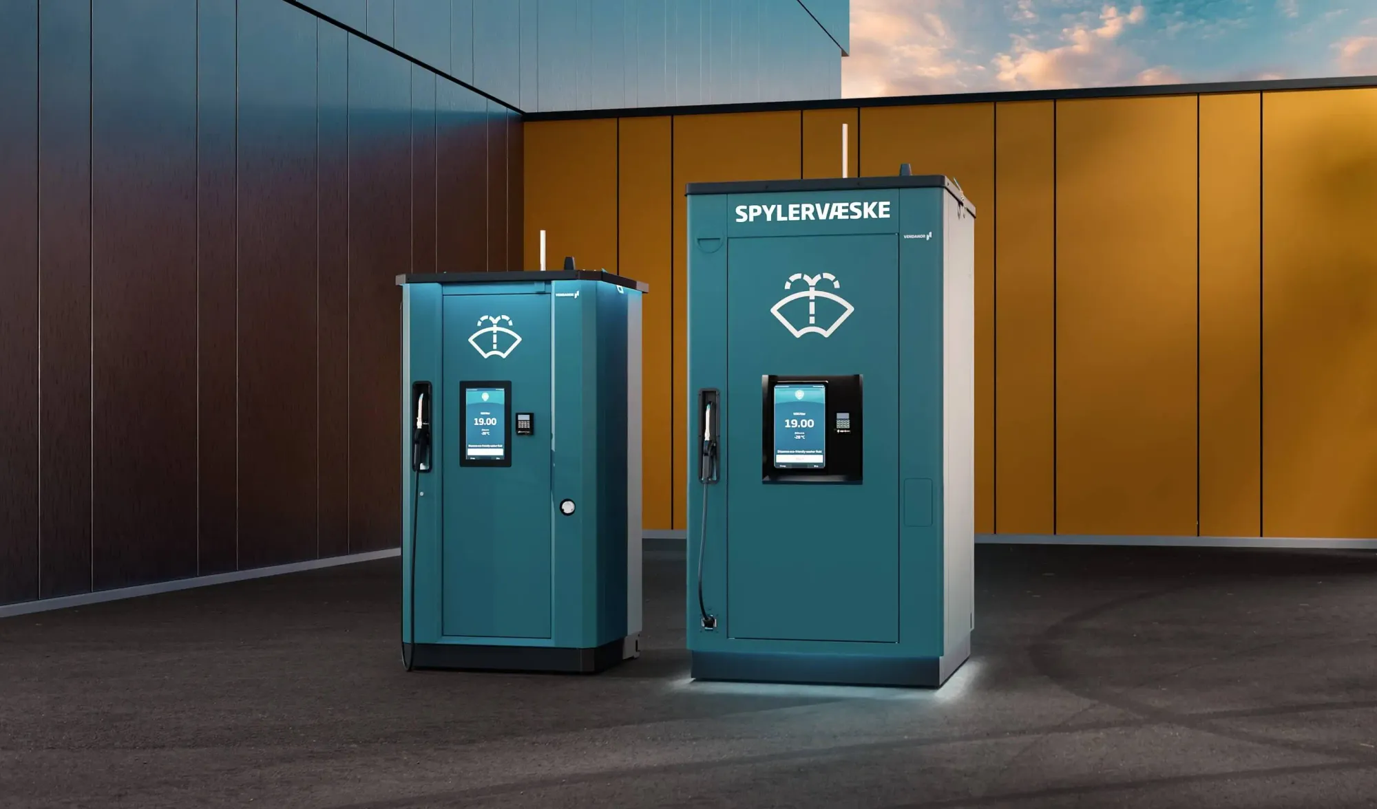 Two Vendanor Washer Fluid Dispensers labelled Spylervæske stand outdoors in front of a wood-panelled wall at dusk.